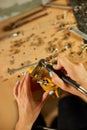 Woman using power working grinder machine, female hand grinds a metal nuts