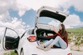 Woman using powerbank smartphone charging and travel by car Royalty Free Stock Photo