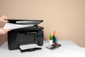 Woman using the printer to scanning and printing document Royalty Free Stock Photo