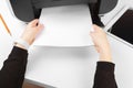 Woman using the printer to scanning and printing document