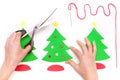 Woman using scissors and making Christmas cards Royalty Free Stock Photo