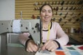 Woman Using Sewing Machine In Laundry Royalty Free Stock Photo