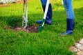 Woman using shovel in her garden Royalty Free Stock Photo