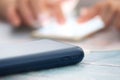 Woman using smart phone while charging on the power bank. Royalty Free Stock Photo