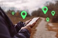 Woman using smart phone with navigation app at street background Royalty Free Stock Photo