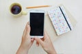 Woman using smart phone on the table Royalty Free Stock Photo