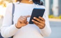 Woman using smartphone with 5G network system outdoors, closeup. Royalty Free Stock Photo