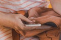 Woman using smartphone outdoors, close up of female hands with mobile phone Royalty Free Stock Photo