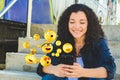 Woman using smartphone sending emojis