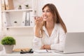 Woman Using Smartphone Voice Assistant Sitting At Laptop In Office Royalty Free Stock Photo