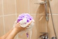 Woman using a soap while taking shower in bathroom Royalty Free Stock Photo
