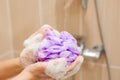 Woman using a soap while taking shower in bathroom. Royalty Free Stock Photo