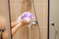 Woman using a soap while taking shower in a bathroom Royalty Free Stock Photo