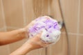 Woman using a soap while taking shower in bathroom. Royalty Free Stock Photo