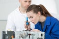 Woman using soldering iron to repair computer Royalty Free Stock Photo