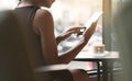 Woman using tablet in coffee shop