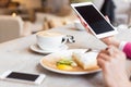 Woman using tablet computer in cafe Royalty Free Stock Photo