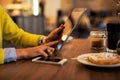 Woman using tablet computer in cafe Royalty Free Stock Photo