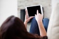 Woman using tablet on couch