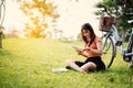 Woman using the tablet and laptop in the park, Outdoor concept, Relax concept, Technology concept
