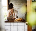 Woman using tablet for online business order