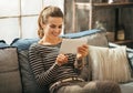 Woman using tablet pc while sitting in apartment Royalty Free Stock Photo