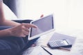 Woman using tablet in bedroom, calendar apps, vintage. Royalty Free Stock Photo