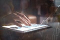 Woman using tablet on a wooden table Royalty Free Stock Photo