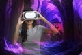 Woman enjoy virtual simulation of halloween night in metavard world