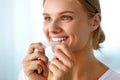 Woman Using Teeth Whitening Strip For Beautiful White Smile Royalty Free Stock Photo
