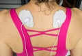 Woman using a TENS Unit