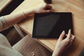 Woman using a touch screen tablet hands close up. Ipad