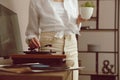 Woman using turntable at home, closeup view