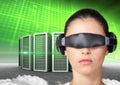 Woman using virtual reality headset against server tower