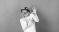 Woman using virtual reality headset. Pretty woman playing game in virtual reality glasses. VR woman. Royalty Free Stock Photo
