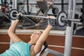 Woman using weight machines Royalty Free Stock Photo