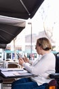 woman using wheelchair working with a tablet