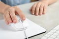 Woman using wired computer mouse on pad at grey marble table, closeup Royalty Free Stock Photo