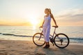 Woman on vacation biking at beach Royalty Free Stock Photo