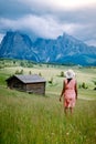 Woman on vacation in the Dolomites Italy,Alpe di Siusi - Seiser Alm with Sassolungo - Langkofel mountain group in Royalty Free Stock Photo