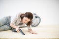 Woman vacuuming carpet Royalty Free Stock Photo