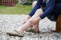 Woman with varicose veins applying compression bandage Royalty Free Stock Photo