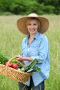 Woman with vegetable basket Royalty Free Stock Photo