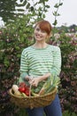 Woman With Vegetable Basket Outdoors