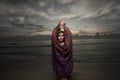 Woman with a veil on the beach Royalty Free Stock Photo
