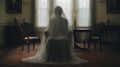 a woman in a veil sits in a chair in a room