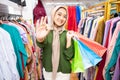 woman in a veil thumbs up inside a boutique shop