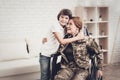 Woman Veteran In Wheelchair Homecoming Concept. Royalty Free Stock Photo