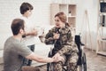 Woman Veteran In Wheelchair Homecoming Concept. Royalty Free Stock Photo