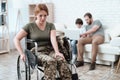 Woman veteran in wheelchair returned from army. A woman in a wheelchair is in pain. She`s in military uniform.